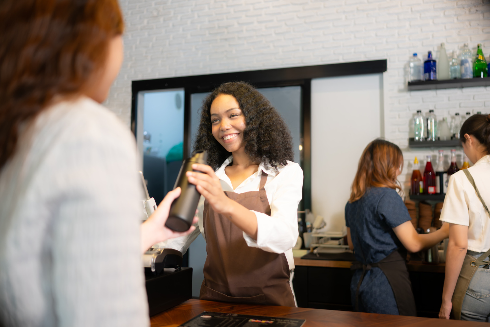 Small business owner serving a customer